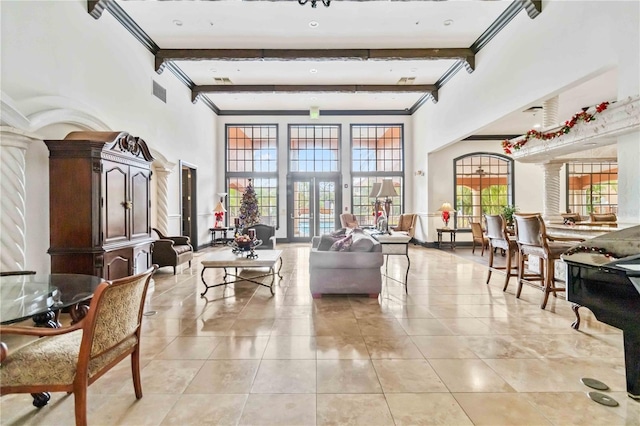 4106 Central Sarasota Pkwy Unit 1013, Sarasota, FL 34238 - building lobby featuring ornamental molding, beam ceiling, and a high ceiling