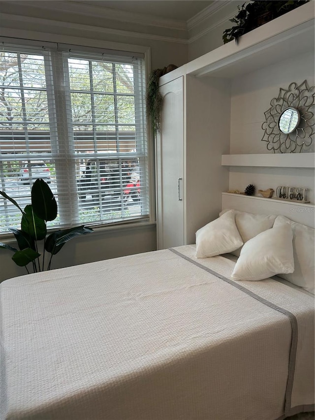 bedroom with ornamental molding