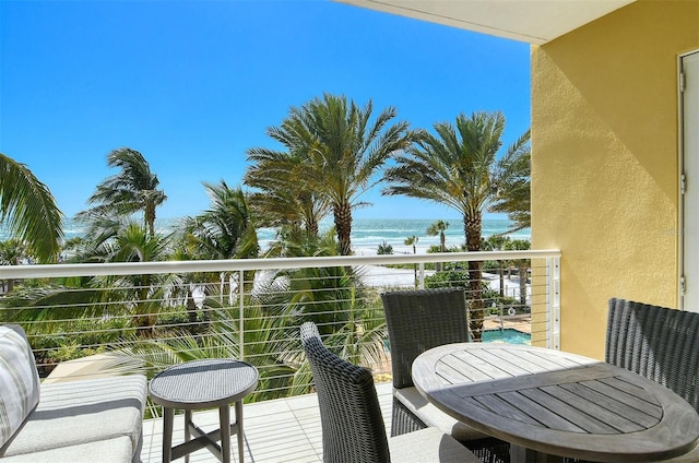 balcony with a view of the beach and a water view