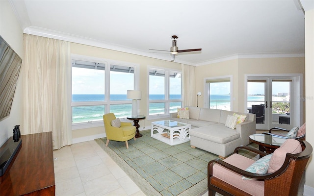 915 Seaside Drive 613, Weeks 4-5, Sarasota, FL 34242 - living room with crown molding, a ceiling fan, a water view, and light tile patterned flooring