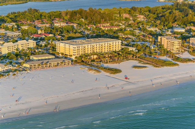 bird's eye view featuring a water view and a beach view