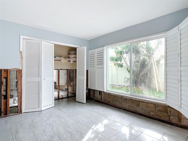 unfurnished bedroom featuring a closet