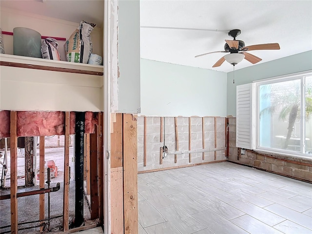 unfurnished room featuring ceiling fan