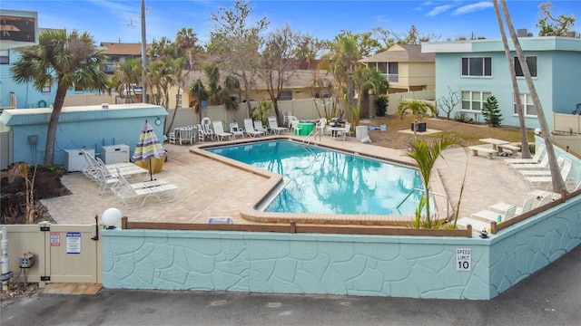 view of swimming pool with a patio area