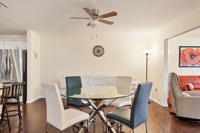 dining room featuring ceiling fan and dark hardwood / wood-style flooring