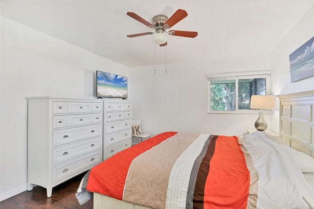 bedroom featuring ceiling fan and dark hardwood / wood-style floors