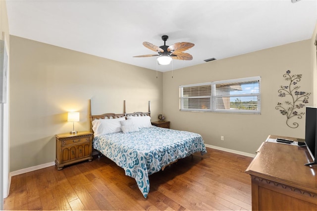 bedroom with hardwood / wood-style flooring and ceiling fan