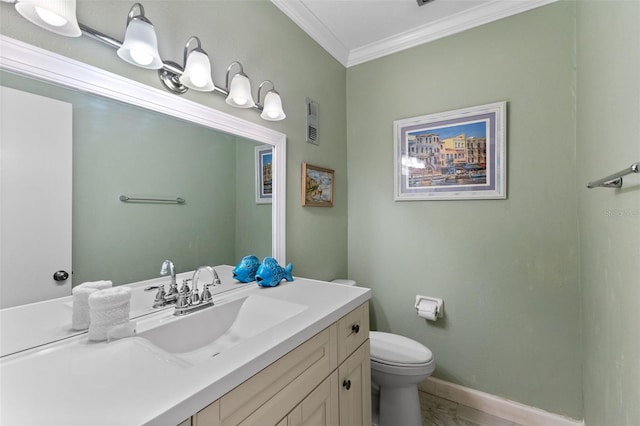 bathroom with vanity, toilet, and crown molding