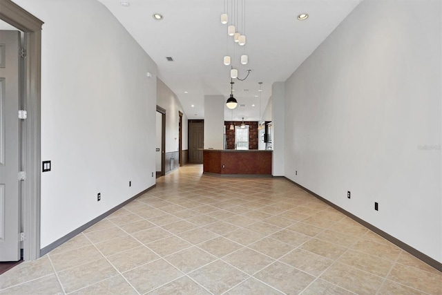 unfurnished room featuring light tile patterned floors