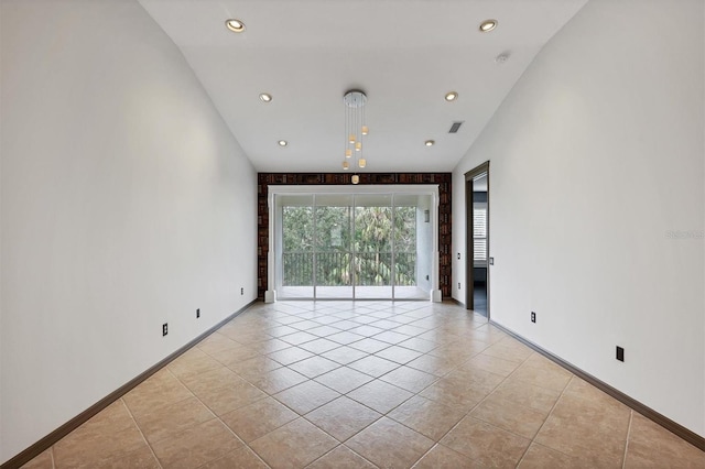 spare room with light tile patterned flooring