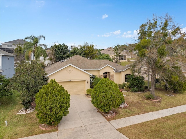 view of front of property featuring a front yard and a garage