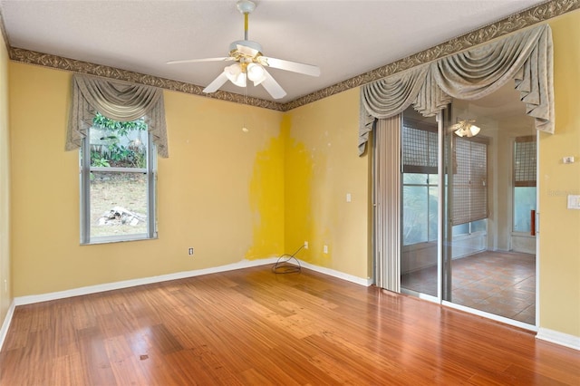 spare room featuring hardwood / wood-style flooring and ceiling fan