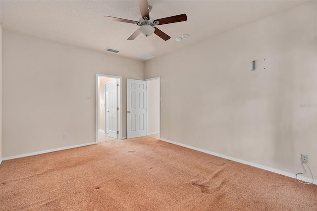 spare room with ceiling fan and carpet floors