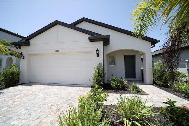 single story home featuring a garage