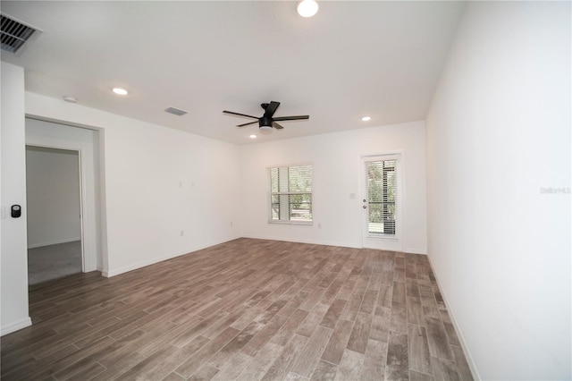 empty room featuring hardwood / wood-style floors and ceiling fan