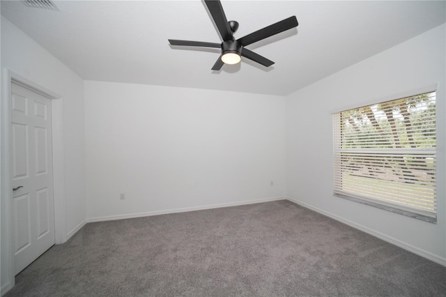 empty room with carpet flooring and ceiling fan