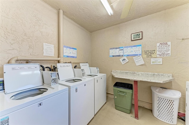 laundry area featuring a textured ceiling and independent washer and dryer