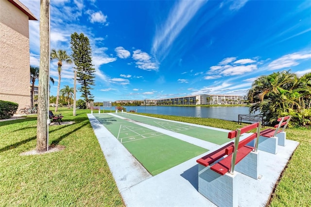 surrounding community featuring a yard and a water view