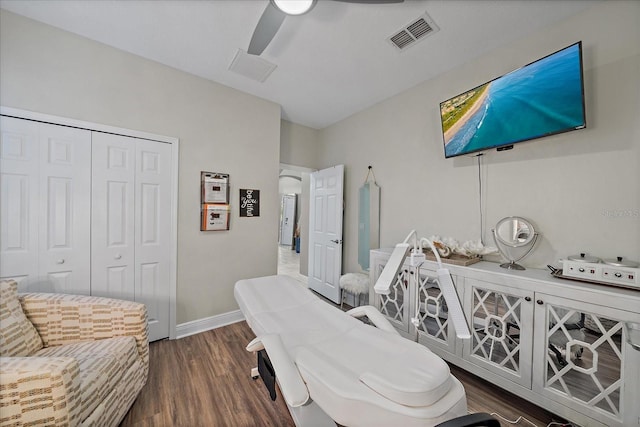 interior space with ceiling fan and dark hardwood / wood-style floors