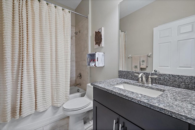 full bathroom featuring tile patterned floors, vanity, toilet, and shower / tub combo with curtain