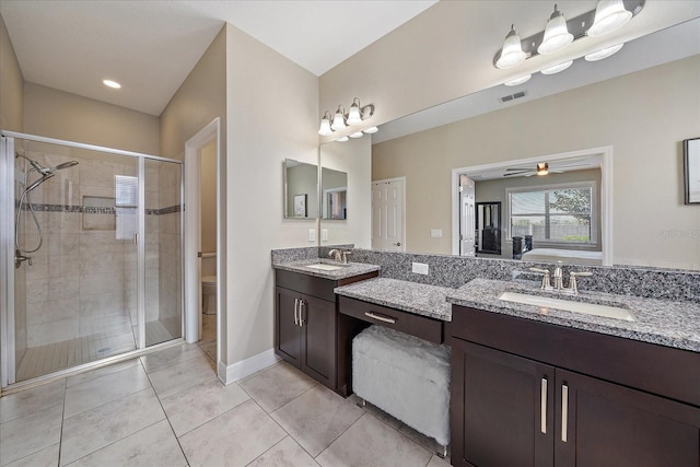 full bathroom with vanity, toilet, ceiling fan, and independent shower and bath