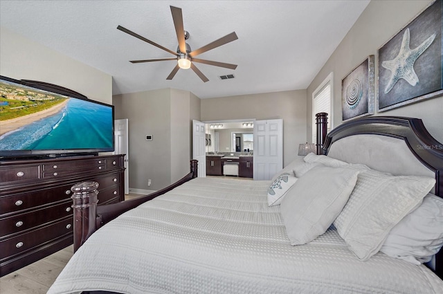 bedroom featuring ceiling fan and light hardwood / wood-style flooring