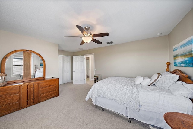 carpeted bedroom featuring ceiling fan