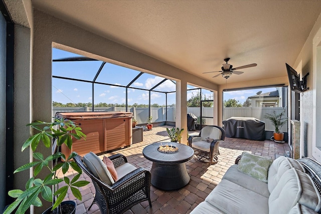 view of patio with area for grilling, an outdoor hangout area, a hot tub, and ceiling fan