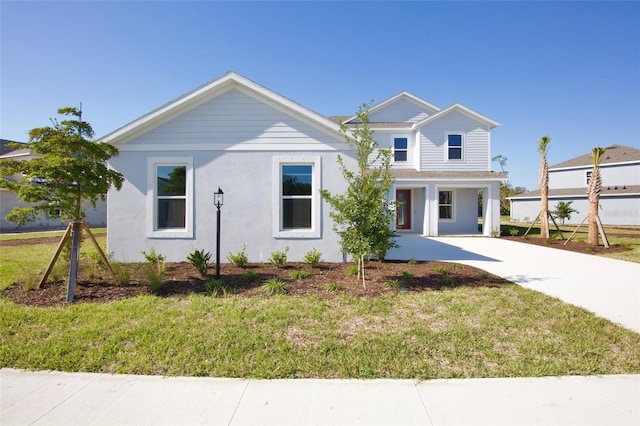 view of front of property with a front lawn