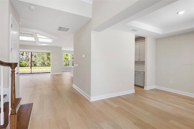 hall with light hardwood / wood-style floors