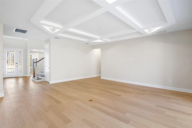 unfurnished living room with beam ceiling, light wood-type flooring, and coffered ceiling