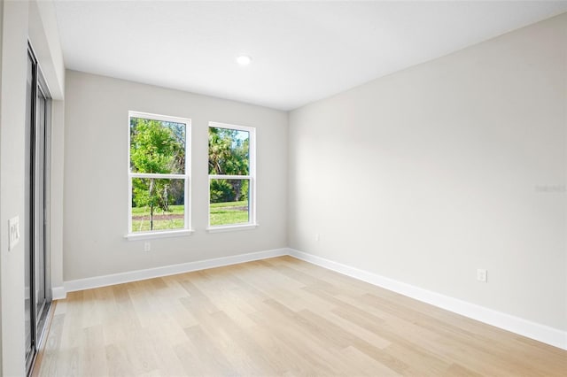 unfurnished room featuring light hardwood / wood-style floors