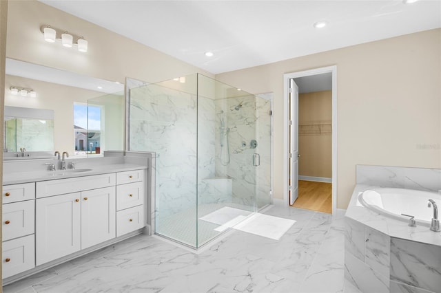 bathroom featuring vanity and plus walk in shower