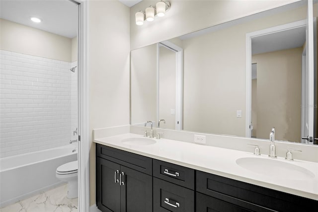 full bathroom featuring vanity, toilet, and tiled shower / bath