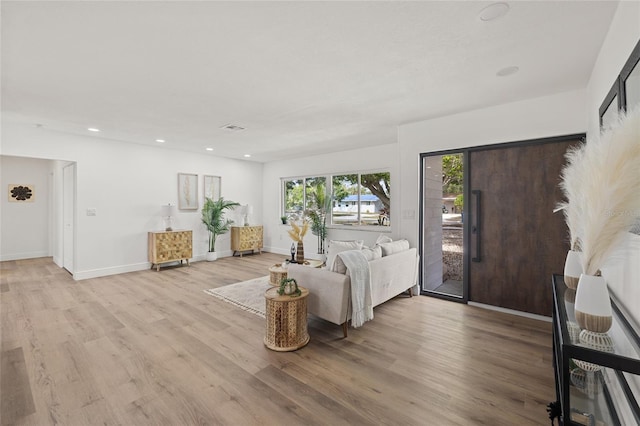 living room with light hardwood / wood-style floors