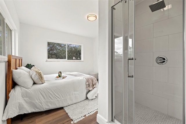 bedroom with hardwood / wood-style flooring