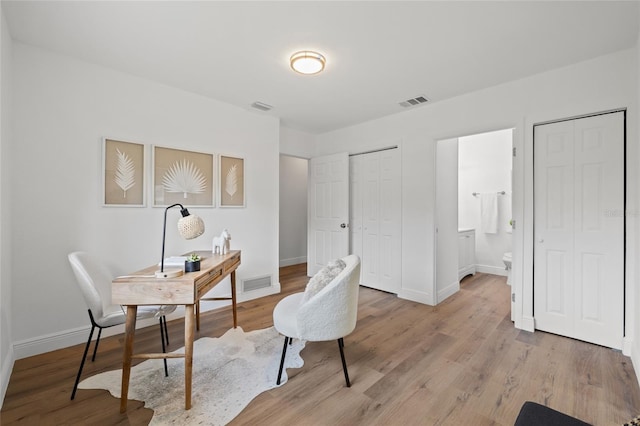 home office featuring light hardwood / wood-style flooring