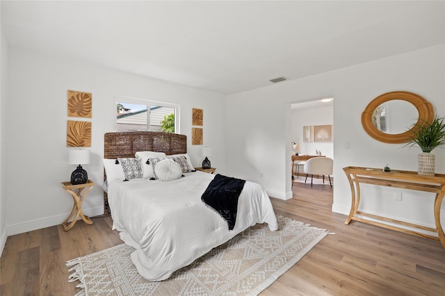 bedroom featuring hardwood / wood-style floors