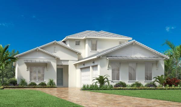 view of property with a garage and a front lawn