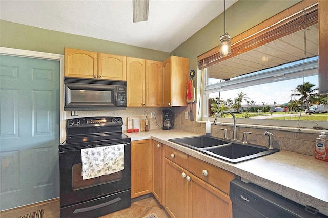 kitchen with decorative light fixtures, sink, backsplash, and black appliances