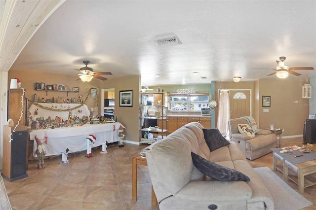 living room with light tile patterned flooring