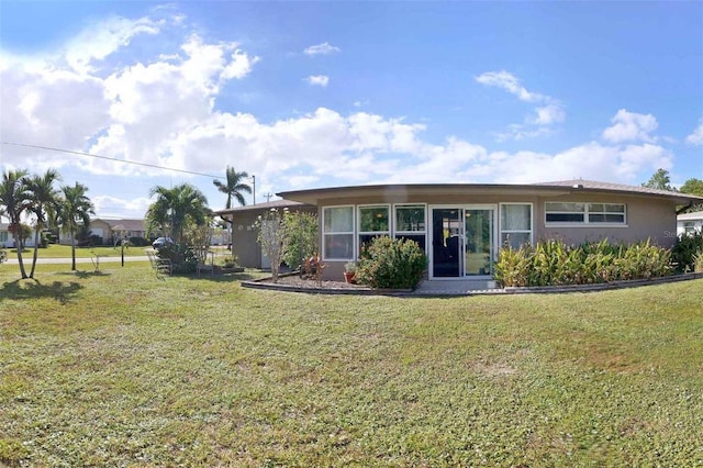 ranch-style home with a front lawn