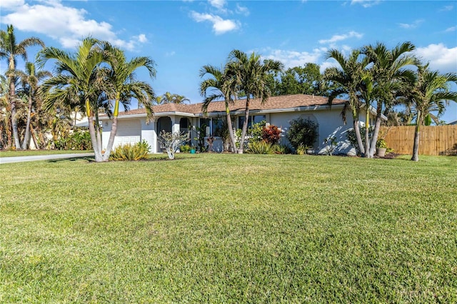 view of front facade with a garage and a front lawn