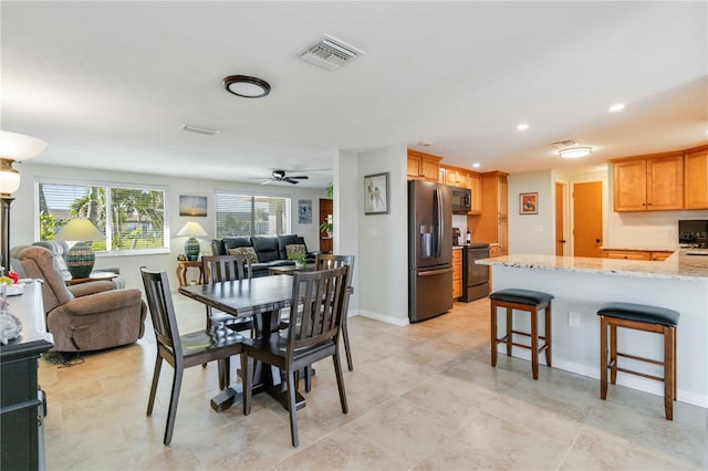 dining space with ceiling fan