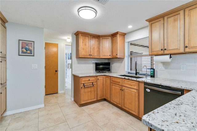 kitchen with sink, tasteful backsplash, light stone counters, stainless steel dishwasher, and light tile patterned floors