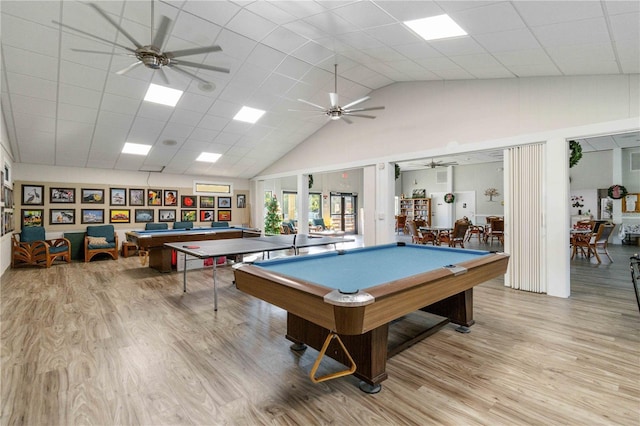 rec room featuring light hardwood / wood-style floors, a towering ceiling, and billiards