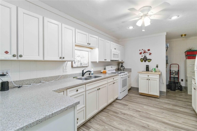 kitchen featuring white appliances, sink, ornamental molding, light stone counters, and white cabinetry