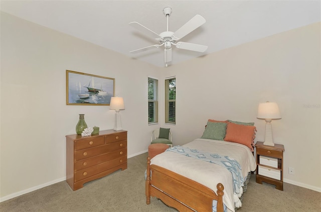 bedroom with light carpet and ceiling fan