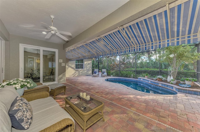 view of swimming pool with ceiling fan, an outdoor hangout area, and a patio