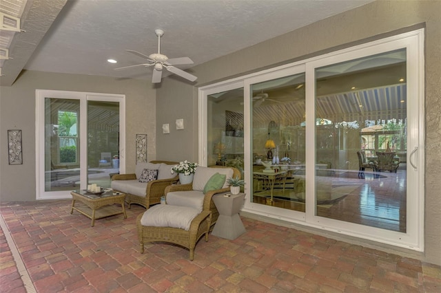 exterior space with an outdoor hangout area and ceiling fan